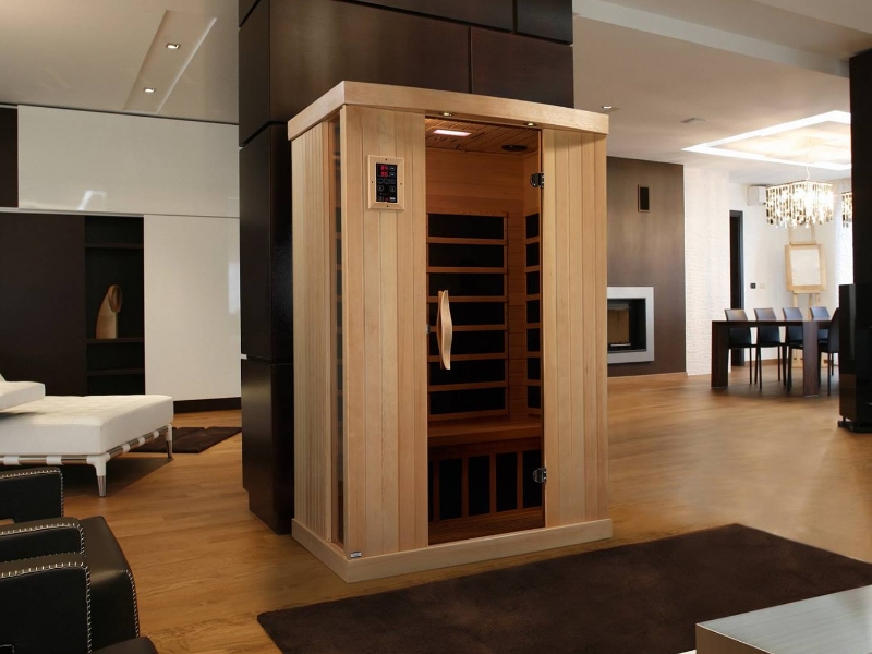 Two-person Golden Designs infrared sauna in a modern living room